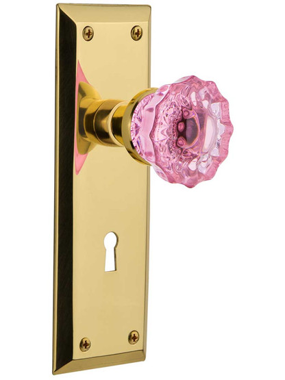 New York Door Set with Keyhole and Colored Fluted Crystal Glass Knobs Pink in Un-Lacquered Brass.